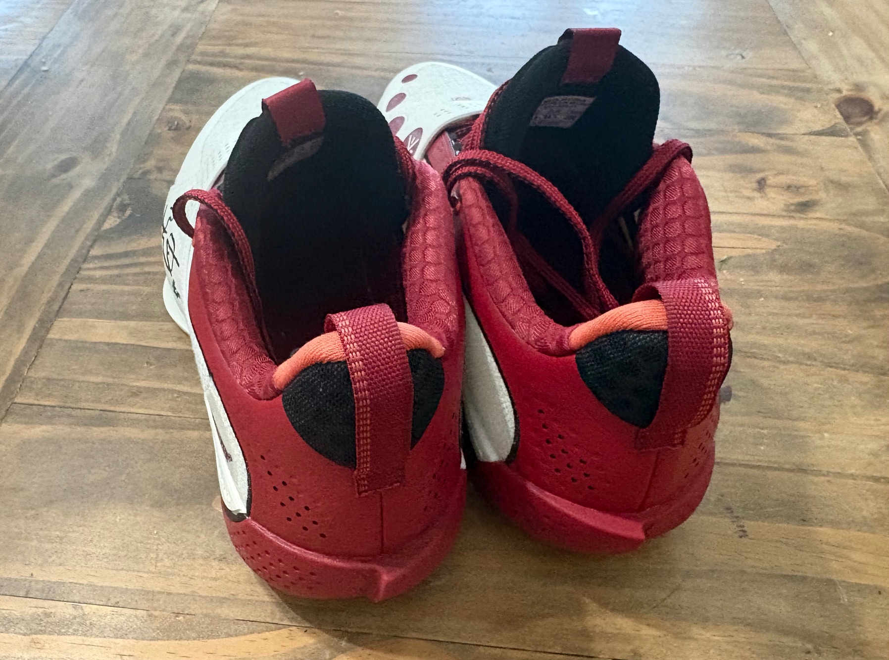 Way of Wade All City 13 Encore 305 - heel view showing red heel counter with black interior and orange pull tabs